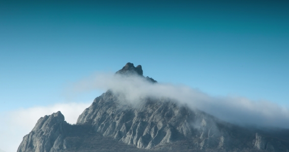 White Clouds Shrouded the Top of the Cliff