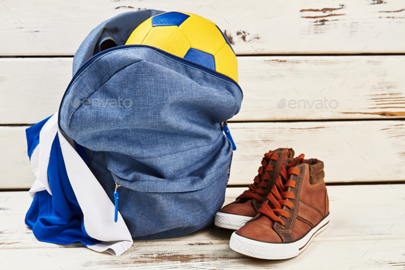 Backpack, sneakers, ball and uniform