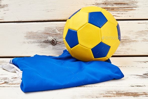 Soccer ball and folded uniform