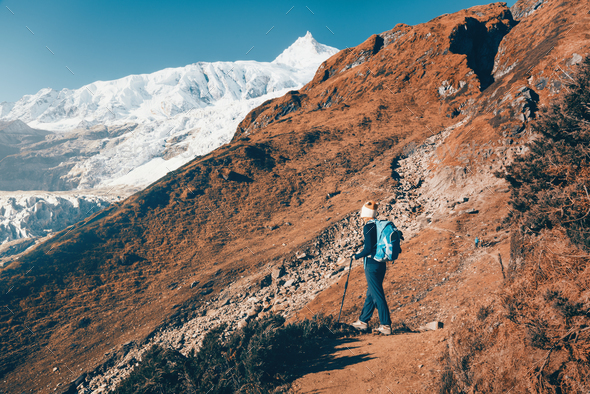 Woman with backpack on the mountain trail - Stock Photo - Images
