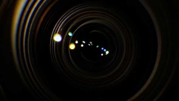 A  of the Lens of a Video Camera. The Light Source Illuminates the Lenses, Then Goes Into Darkness alt