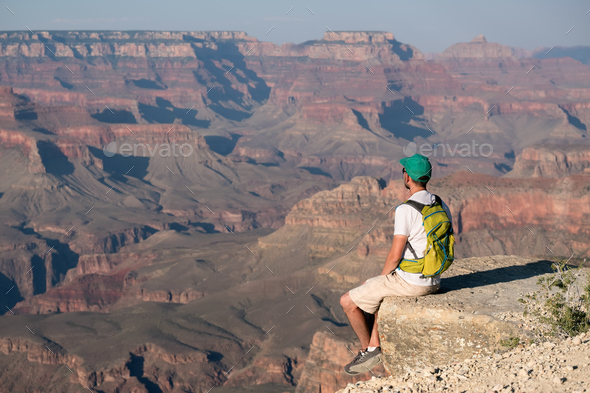 Tourist with backpack at Grand Canyon Stock Photo by haveseen | PhotoDune