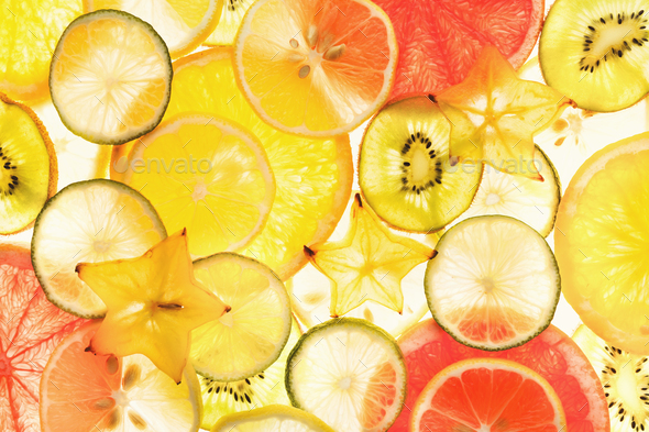 Backlit citrus fruits slices background - Stock Photo - Images