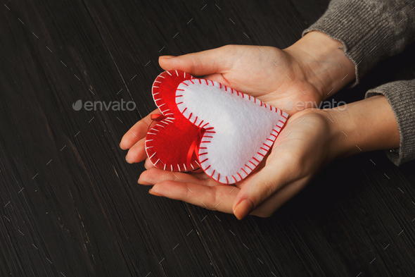 Valentine day background, pillow hearts in female hands - Stock Photo - Images