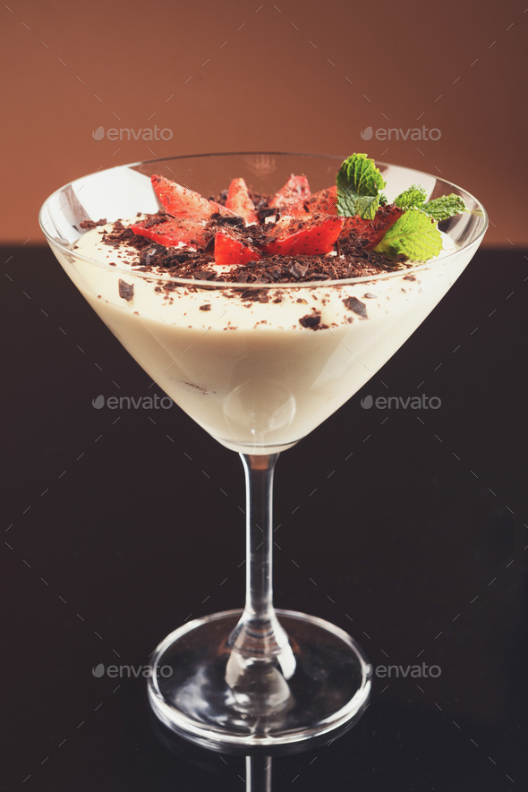 Traditional italian tiramisu in martini glass - Stock Photo - Images