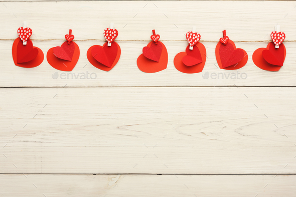 Valentine day background, paper hearts border on wood, copy space - Stock Photo - Images