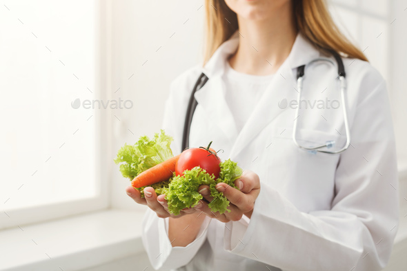 Unrecognizable nutritionist woman with vegetables - Stock Photo - Images