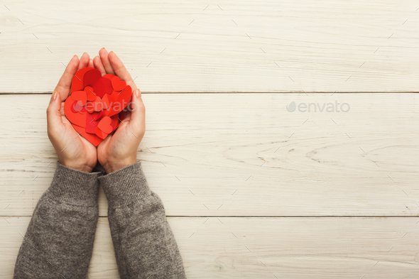 Valentine day background, clothespins in female hands - Stock Photo - Images