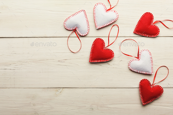 Valentine day background, handmade pillow hearts on wood, copy space - Stock Photo - Images