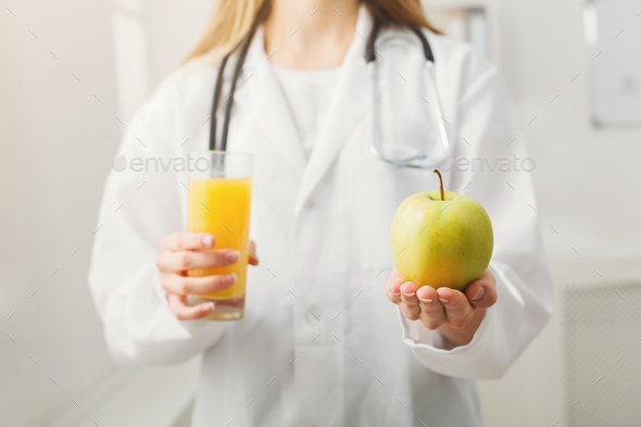Unrecognizable nutritionist woman with fruit - Stock Photo - Images