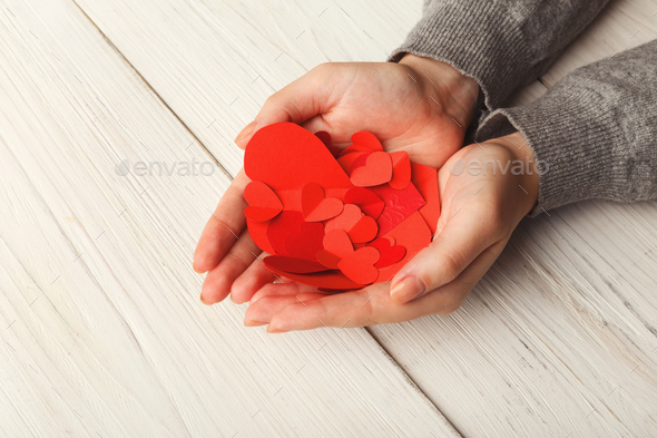 Valentine day background, hearts in female hands - Stock Photo - Images