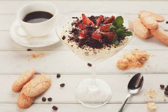 Traditional italian tiramisu in martini glass - Stock Photo - Images