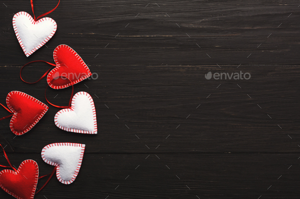 Valentine day background, handmade pillow hearts on wood, copy space - Stock Photo - Images