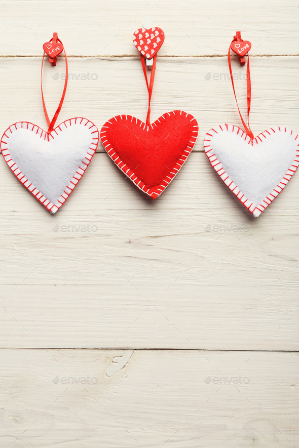 Valentine day background, handmade pillow hearts on wood, copy space - Stock Photo - Images