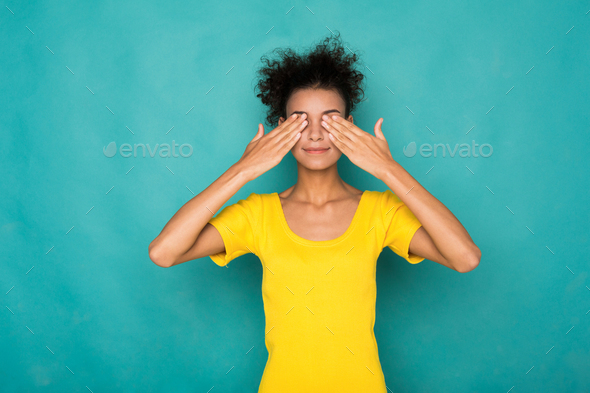 Black woman covering eyes with hands, see no evil Stock Photo by Milkosx