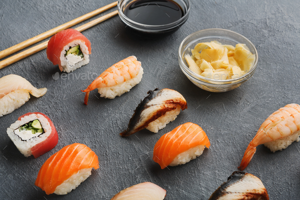 Sushi and rolls on gray background - Stock Photo - Images