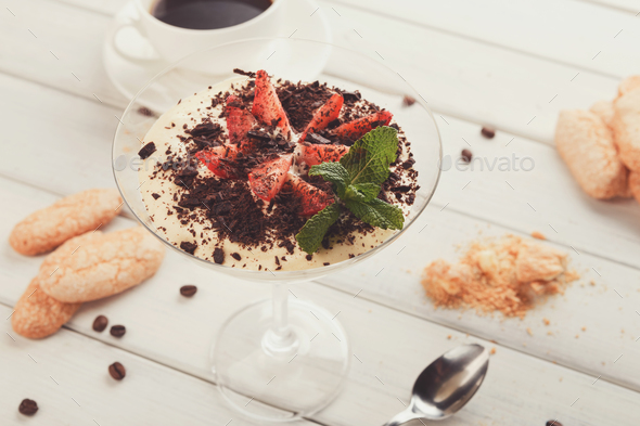 Traditional italian tiramisu in martini glass - Stock Photo - Images