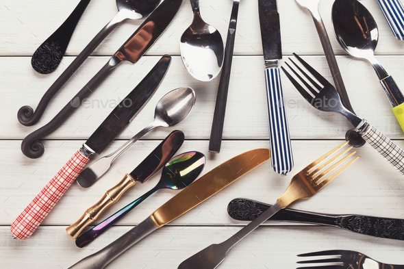 Collection of modern and antique cutlery, top view - Stock Photo - Images