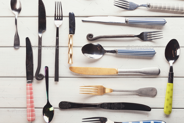 Collection of modern and antique cutlery, top view - Stock Photo - Images