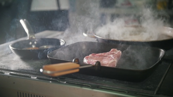 The Meat on the Grill Cooked in Restaurant, alt