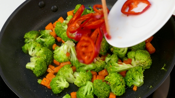 Fry Vegetables in Oil in a Frying Pan