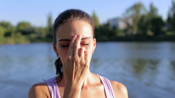 Girl Practicing the Breathing Technique in Yoga alt