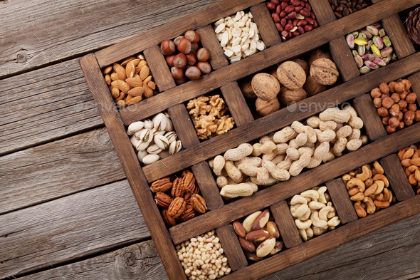 Various nuts in wooden box - Stock Photo - Images