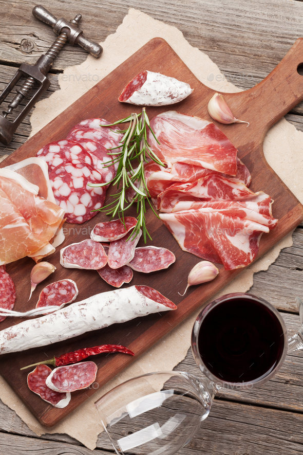 Salami, ham, sausage, prosciutto and wine - Stock Photo - Images