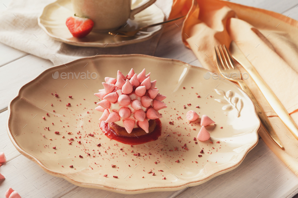 Pink restaurant dessert on porcelain plate
