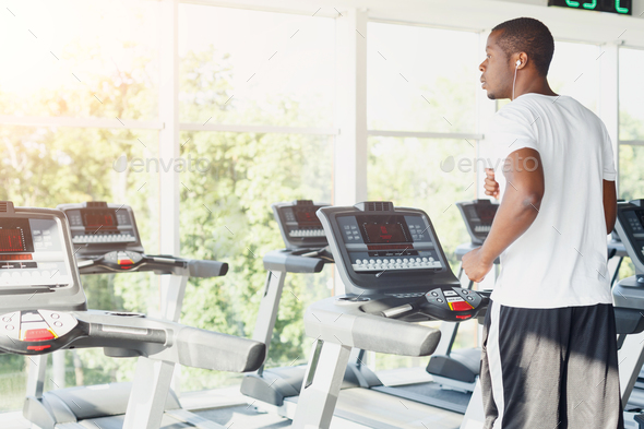 Man on treadmill in fitness club, healthy lifestyle - Stock Photo - Images