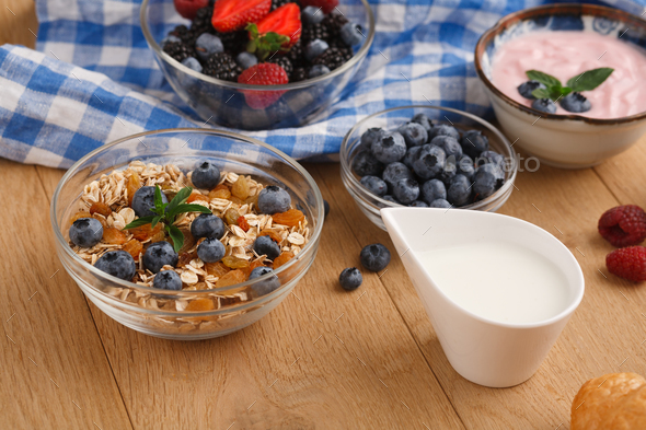 Rich breakfast on natural wooden table - Stock Photo - Images