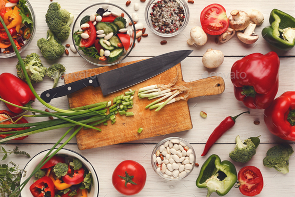 Various salad bowls on white wooden table, top view - Stock Photo - Images