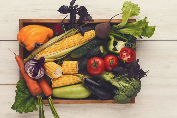 Plenty of fresh vegetables on wooden background with copy space - Stock Photo - Images