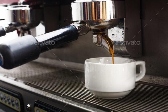 Professional coffee machine making espresso in a cafe - Stock Photo - Images