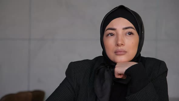 Thoughtful Concerned Business Young Muslim Arabian Woman in Hijab Thinking Solving Problem in Office
