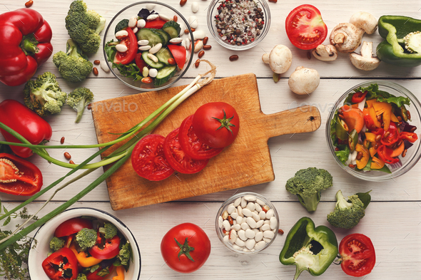Various salad bowls on white wooden table, top view - Stock Photo - Images
