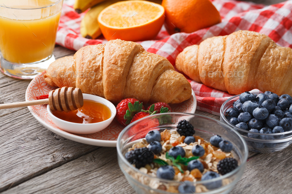 Fresh crusty croissants and orange juice for morning meals - Stock Photo - Images