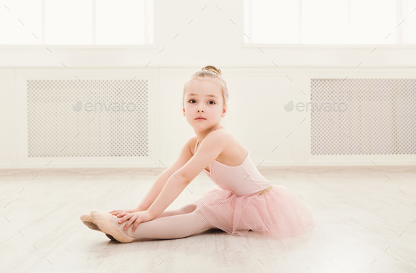 Portrait of little ballerina on floor, copy Stock Photo by Prostock-studio