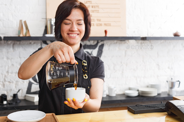 Download Portrait of young barista at coffee shop counter Stock Photo by Prostock-studio