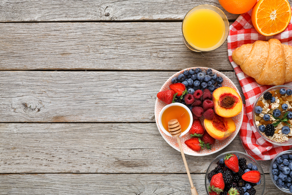 Fresh crusty croissants and orange juice for morning meals - Stock Photo - Images