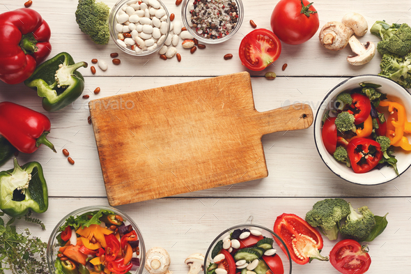 Various salad bowls on white wooden table, top view - Stock Photo - Images