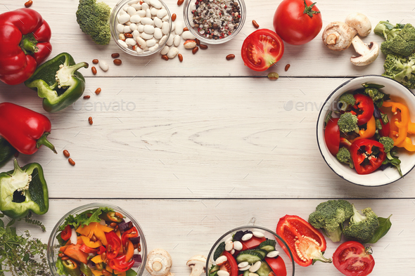 Various salad bowls on white wooden table, top view - Stock Photo - Images