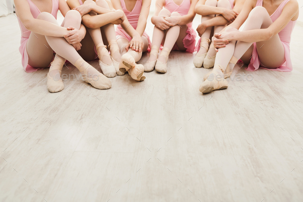 Little ballerinas talking in ballet studio - Stock Photo - Images