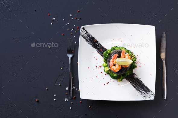 Modern restaurant food. Dorado fillet in nori with shrimps - Stock Photo - Images