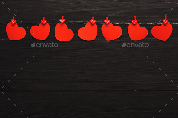 Valentine day background, paper hearts border on wood, copy space - Stock Photo - Images
