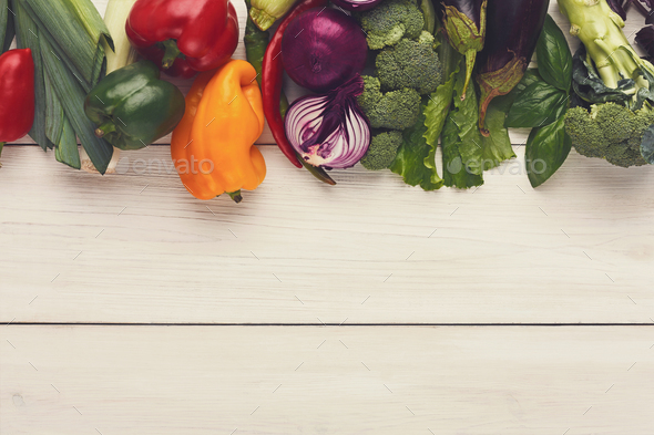 Border of fresh vegetables on wooden background with copy space - Stock Photo - Images