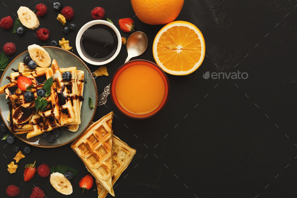 Belgian waffles with berries and fruits copy space - Stock Photo - Images