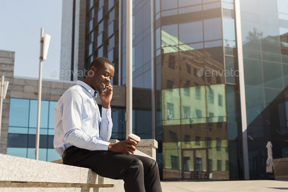 Black businessman outdoors in smart casual ware - Stock Photo - Images