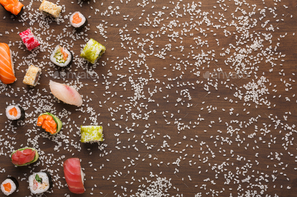 Set of sushi, maki and rolls with sesame on wooden rustic background, copy space - Stock Photo - Images