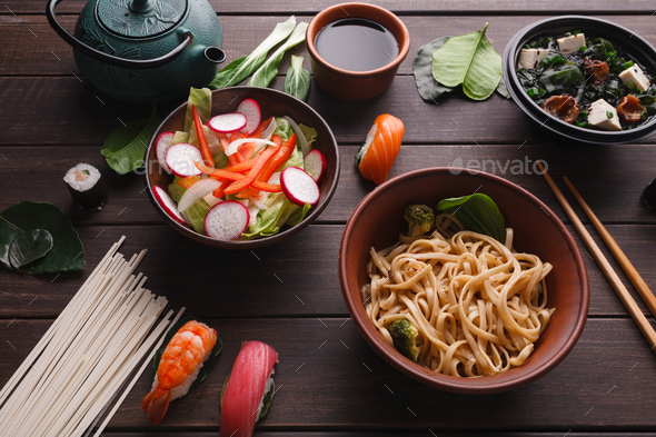 Asian food on wooden background, copy space - Stock Photo - Images